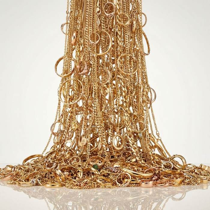 Gold jewellery being weighed — Gold Exchange promotion